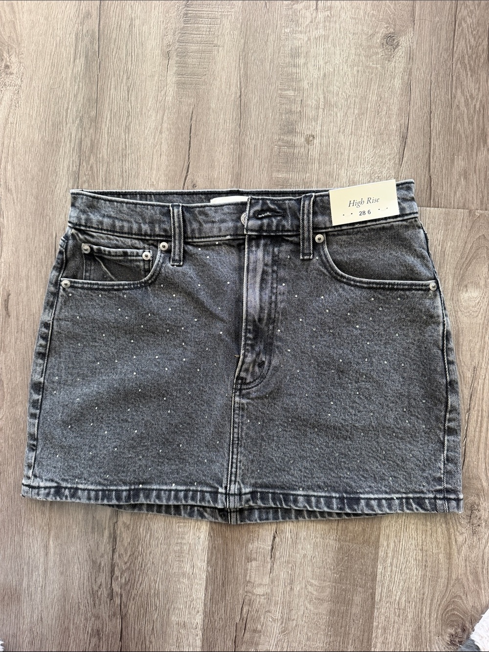 High-Rise Black Denim Mini Skirt with Subtle rhinestone Detail